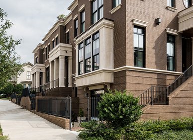 Row of modern brown-brick townhomes