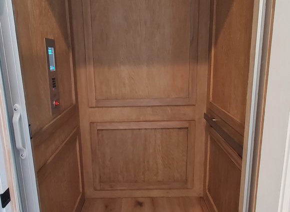 Elevator interior with beautiful wood paneling