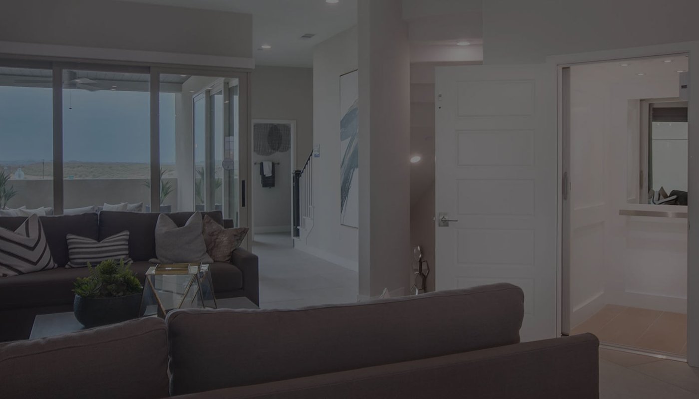 Modern living room with an open elevator entrance on the right