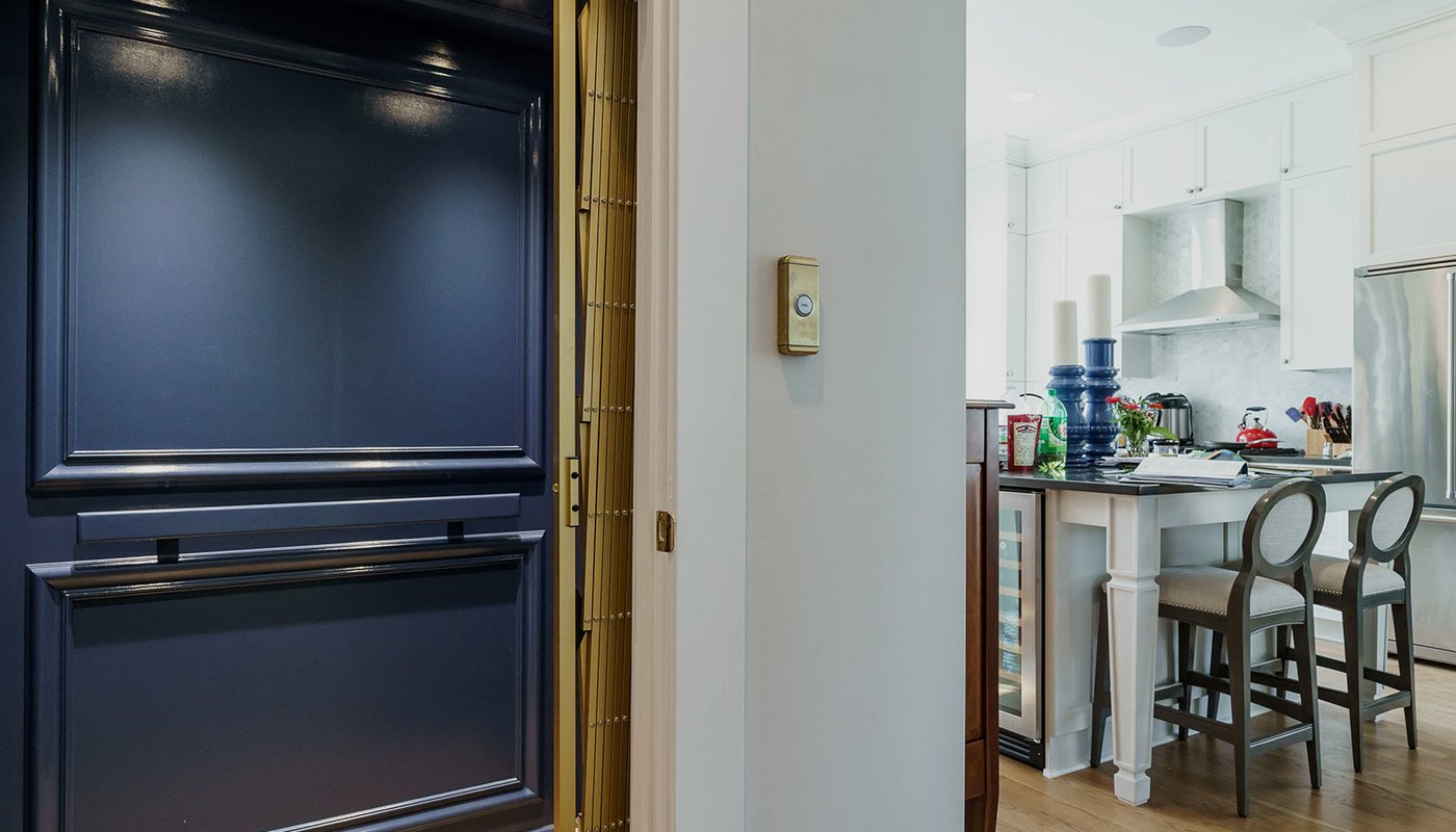 Home elevator with navy blue interior off kitchen