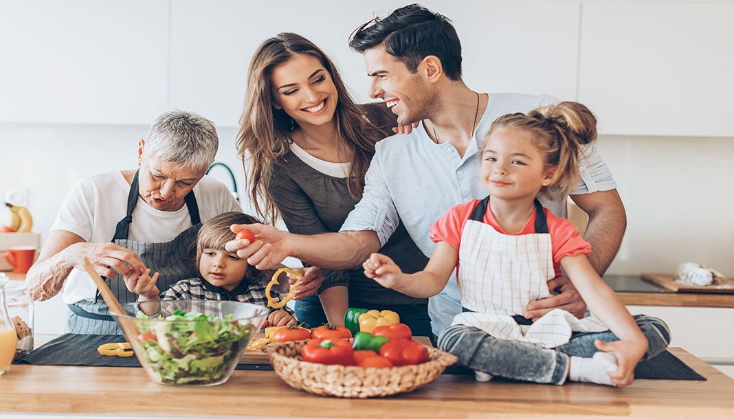 Multi generational family preparing a meal