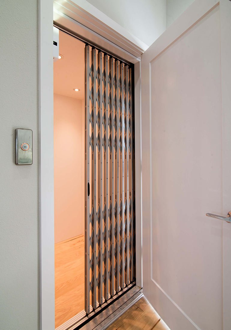 Home elevator with sliver gate and call button
