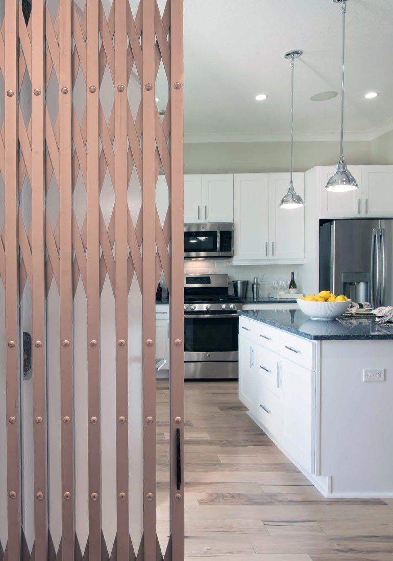 Kitchen visible through an open elevator gate
