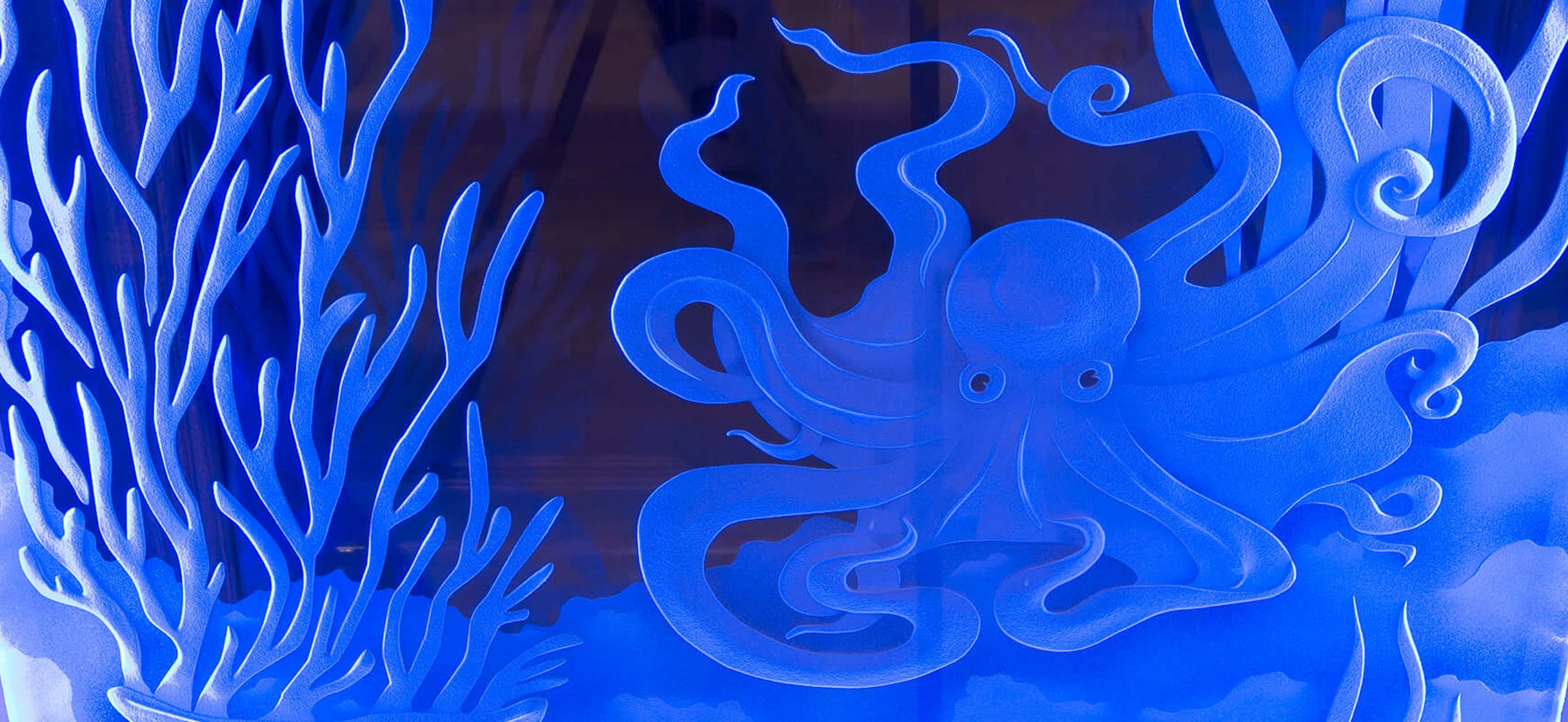 Etched blue glass panel that resembles a fish tank