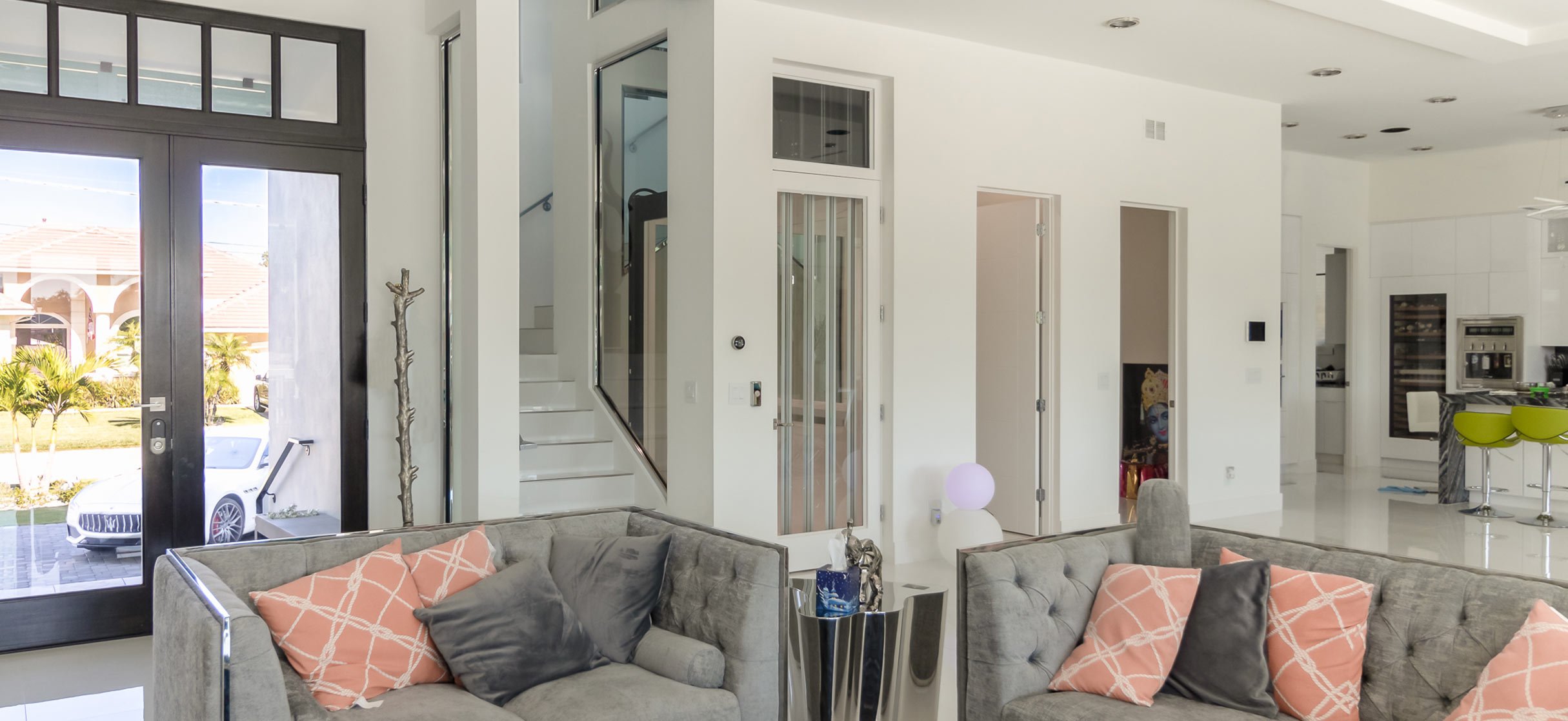 Elevator off living room in open concept home