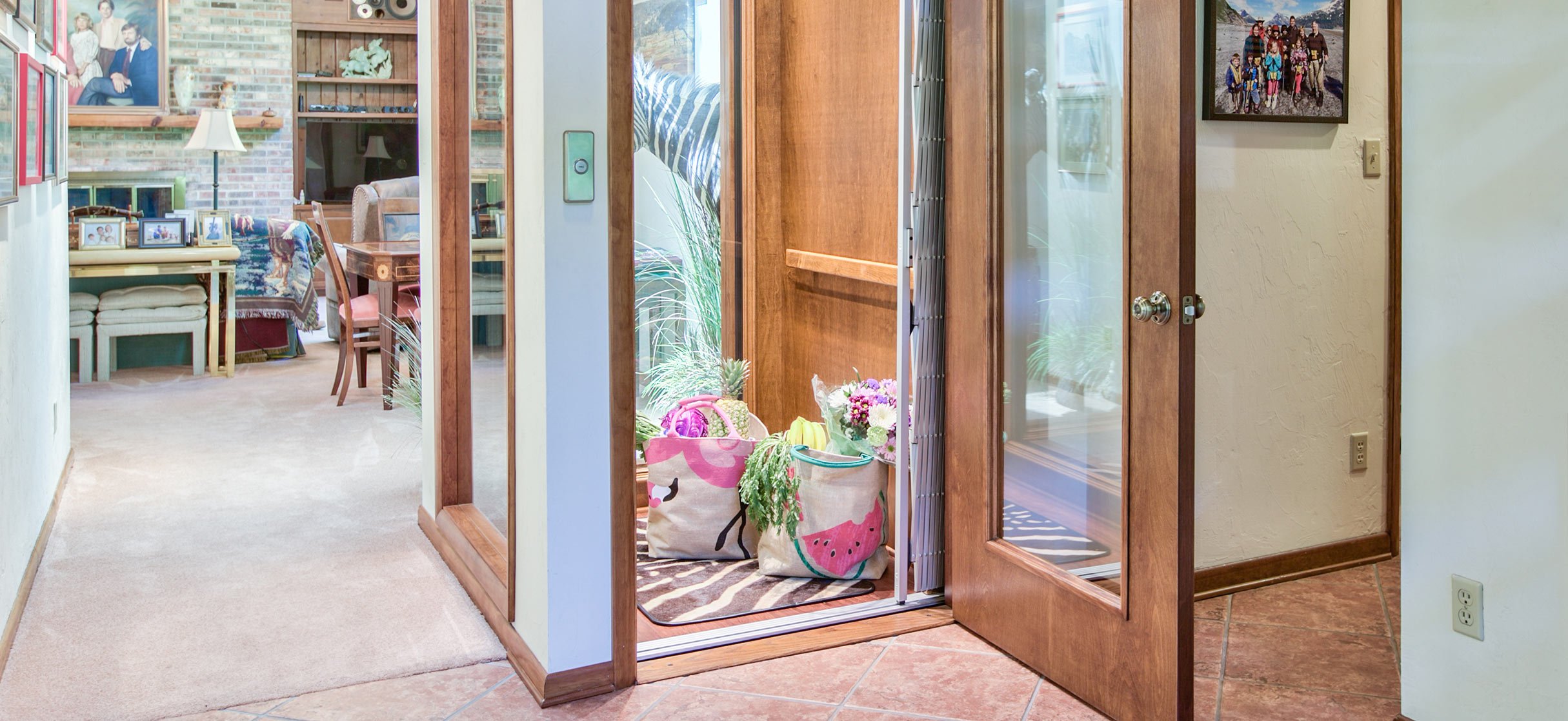 Home elevator with open wooden doors