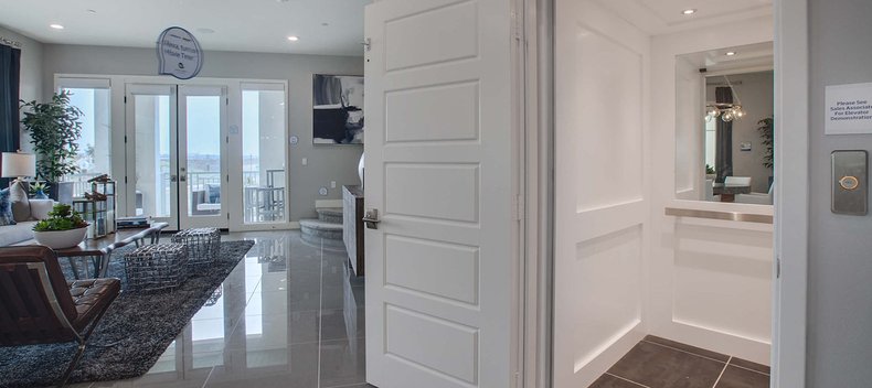 Modern living room with an open white residential elevator